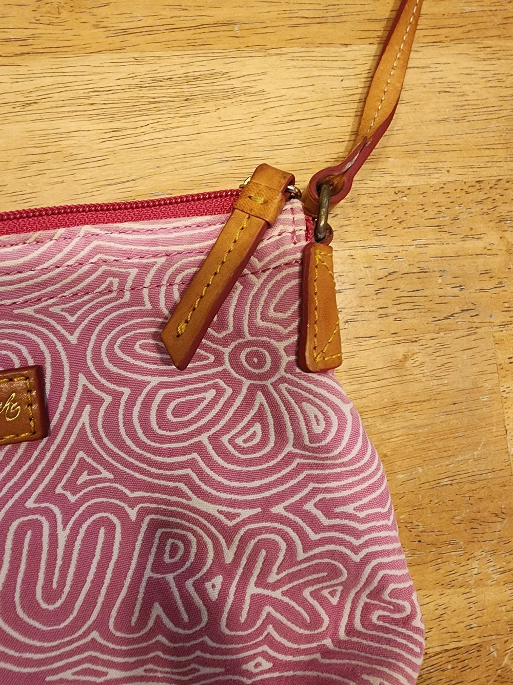 Dooney & Bourke pink doodle swirl canvas mini shoulder bag featuring tan leather